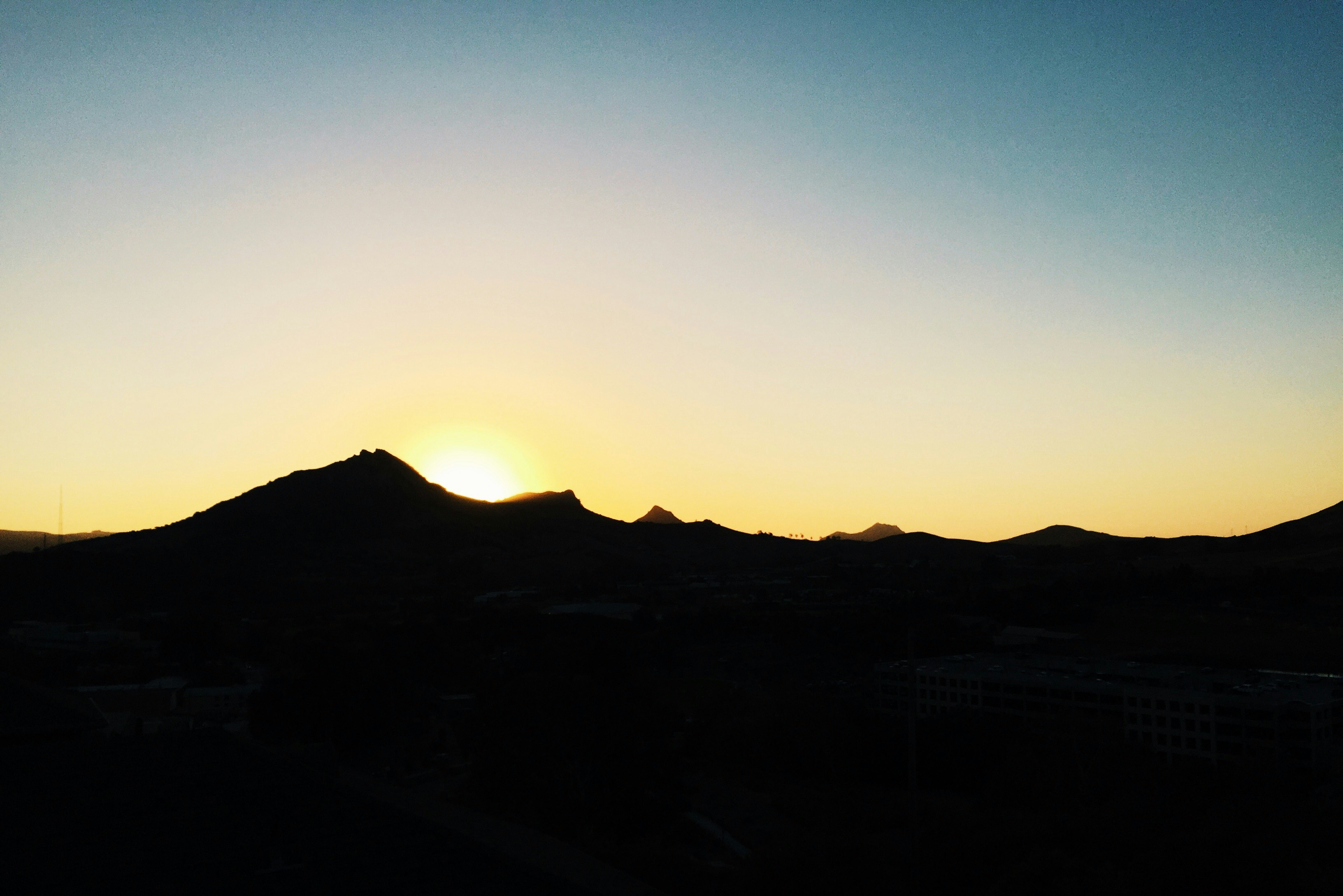 silhouette of mountain during golden hour